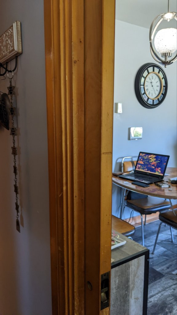 The solid wood pocket door. I've pulled it out to make sure that it worked.  What you can't see or hear, is me squealing like a fan girl.
